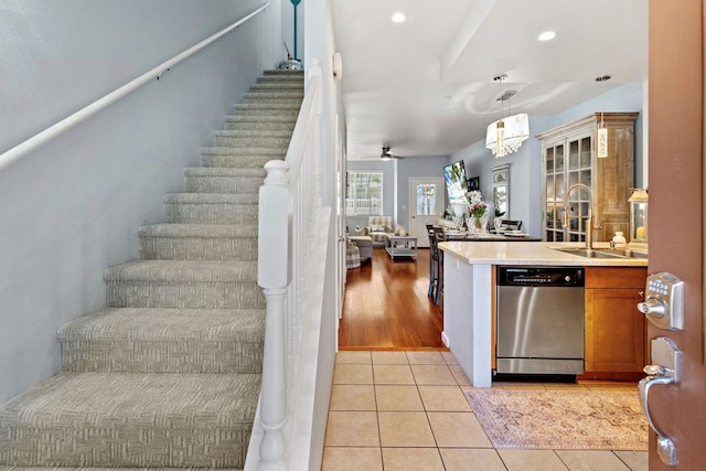 interior space featuring ceiling fan, sink, and hardwood / wood-style floors