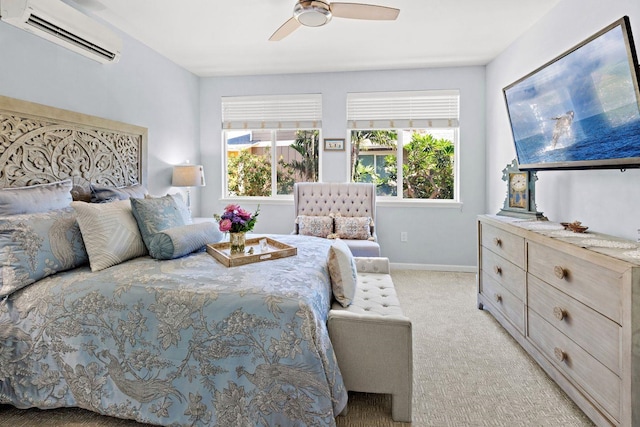 bedroom featuring ceiling fan, a wall unit AC, and light carpet