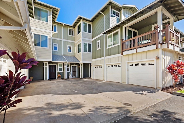 multi unit property with a garage and a balcony