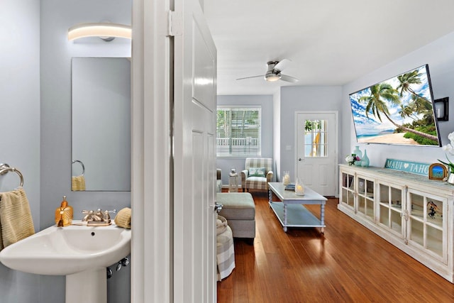 bathroom featuring wood-type flooring, sink, and ceiling fan