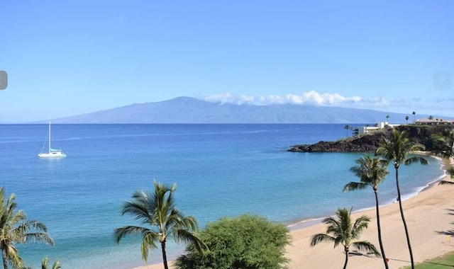 property view of water with a mountain view and a beach view