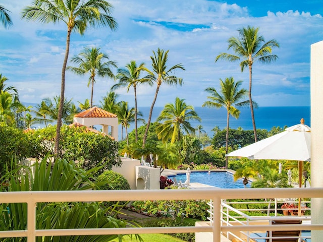 view of pool with a water view