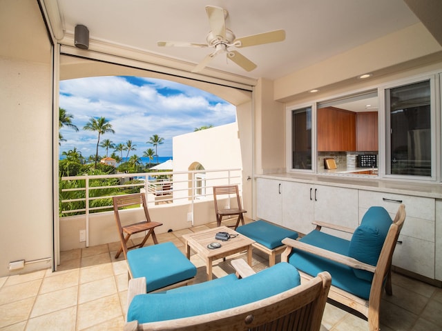 view of patio featuring ceiling fan, an outdoor hangout area, and a balcony