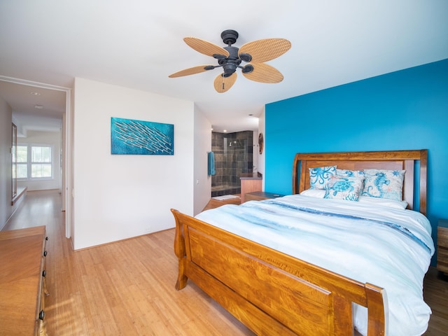 bedroom featuring ensuite bath, ceiling fan, and light hardwood / wood-style floors