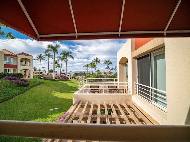 view of patio featuring a balcony