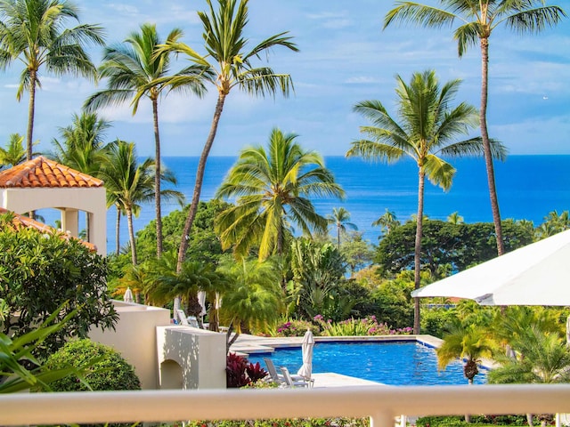 view of pool with a water view