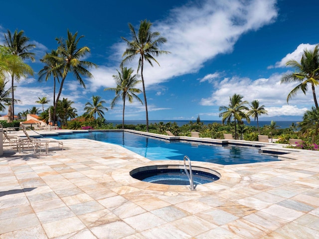 view of pool featuring a community hot tub and a patio area