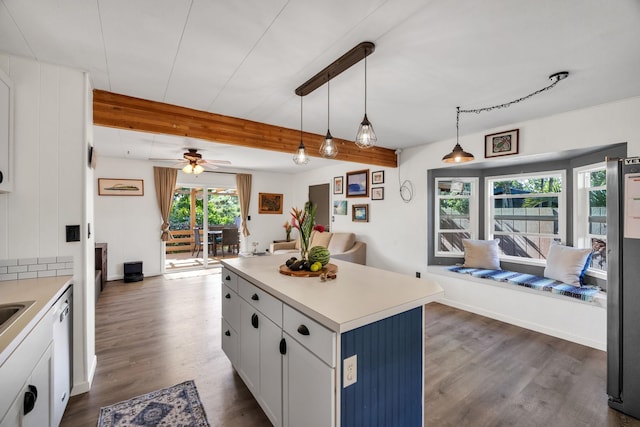 5131 Hanawai St Unit F, Lahaina, HI 96761 - kitchen featuring open floor plan, beamed ceiling, dark wood-type flooring, a ceiling fan, and light countertops