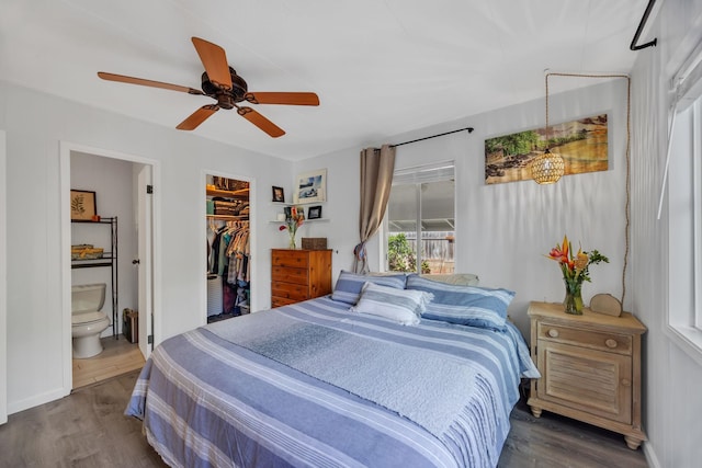 5131 Hanawai St Unit F, Lahaina, HI 96761 - bedroom featuring wood finished floors, ensuite bath, a walk in closet, and a ceiling fan