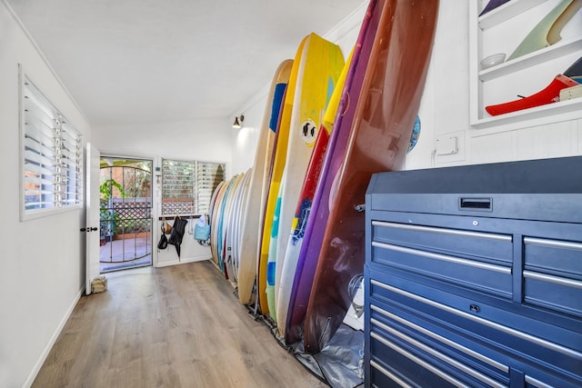 5131 Hanawai St Unit F, Lahaina, HI 96761 - hallway with wood finished floors, vaulted ceiling, and baseboards