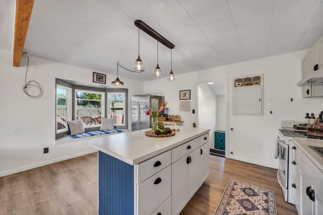 5131 Hanawai St Unit F, Lahaina, HI 96761 - kitchen featuring freestanding refrigerator, white range, white cabinets, and light countertops