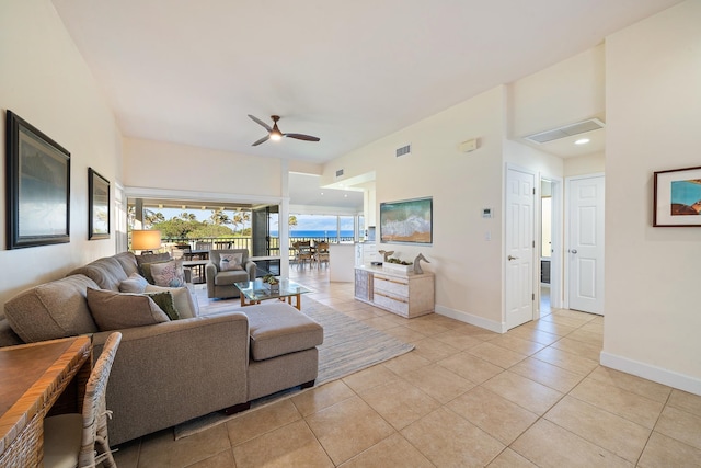 living room with ceiling fan and light tile patterned floors