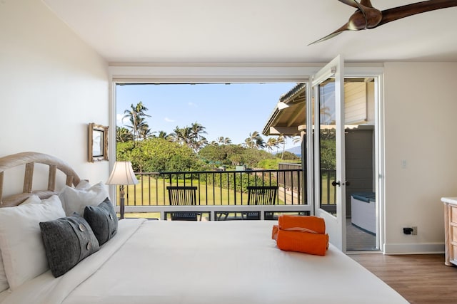 bedroom featuring access to outside, ceiling fan, and hardwood / wood-style floors