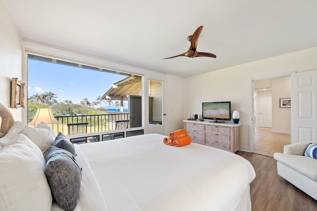 bedroom with hardwood / wood-style flooring and ceiling fan