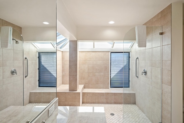 bathroom featuring plenty of natural light and an enclosed shower