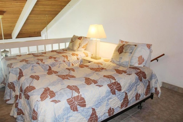 bedroom with vaulted ceiling with beams, wooden ceiling, and tile patterned floors