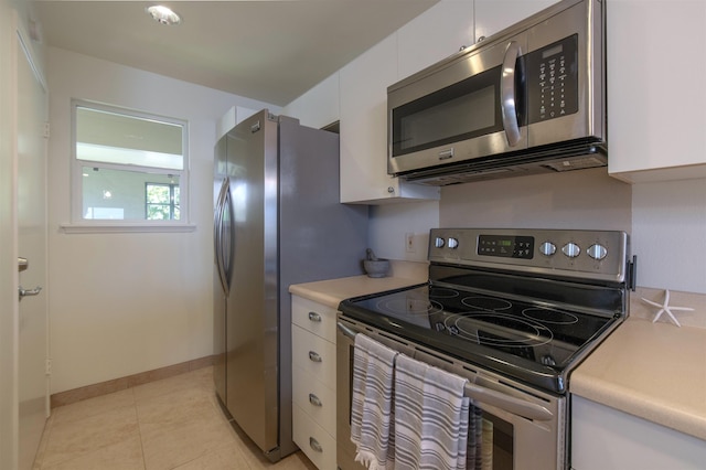 43 Polohina Ln Unit 13-8, Lahaina, HI 96761 - kitchen featuring stainless steel appliances, light countertops, white cabinetry, and light tile patterned floors