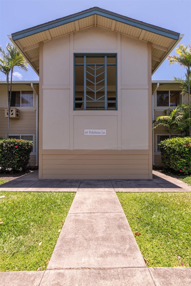 43 Polohina Ln Unit 13-8, Lahaina, HI 96761 - view of front of house featuring a front yard and stucco siding