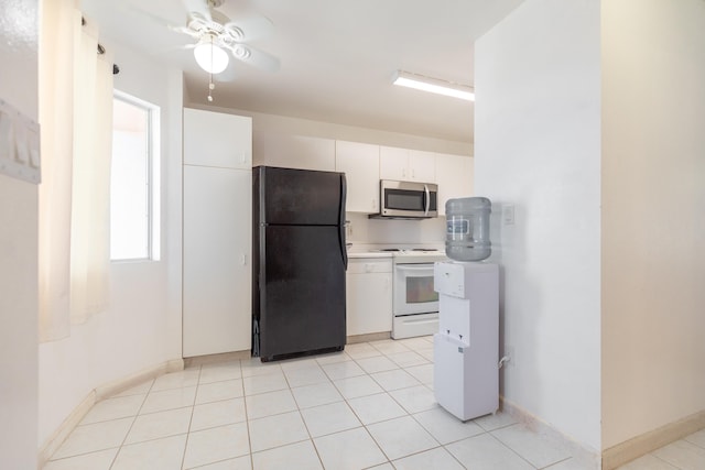 kitchen with white electric range oven, white cabinetry, black fridge, light tile patterned flooring, and ceiling fan