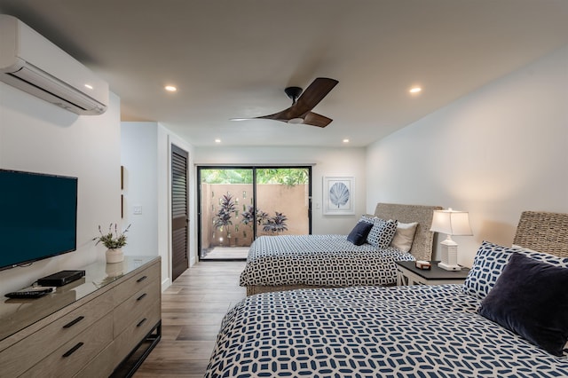 3300 Wailea Alanui Dr Unit 32A, Kihei, HI 96753 - bedroom with an AC wall unit, access to exterior, wood finished floors, recessed lighting, and ceiling fan