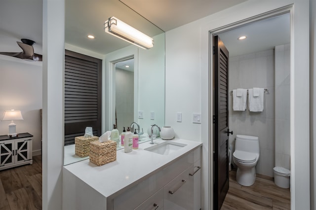 3300 Wailea Alanui Dr Unit 32A, Kihei, HI 96753 - bathroom featuring wood finished floors, toilet, vanity, and recessed lighting
