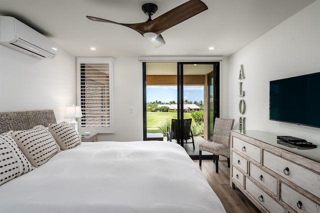 3300 Wailea Alanui Dr Unit 32A, Kihei, HI 96753 - bedroom with a wall mounted air conditioner, dark wood-type flooring, access to exterior, floor to ceiling windows, and recessed lighting