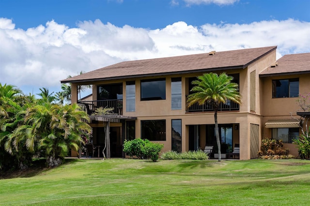 3300 Wailea Alanui Dr Unit 32A, Kihei, HI 96753 - rear view of property featuring a balcony, a lawn, and stucco siding