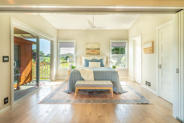 bedroom with baseboards, ceiling fan, access to outside, and light wood-style floors