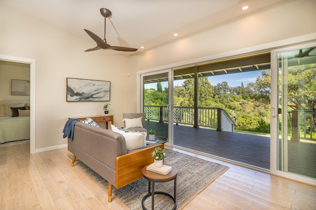 living room with recessed lighting, light wood-style floors, and ceiling fan