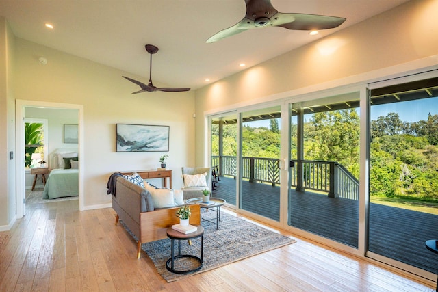 living area featuring hardwood / wood-style floors, baseboards, recessed lighting, and a ceiling fan