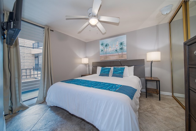 tiled bedroom featuring ceiling fan and multiple windows