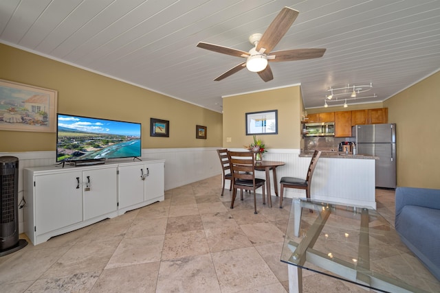 tiled dining space featuring track lighting, ceiling fan, wooden ceiling, and crown molding