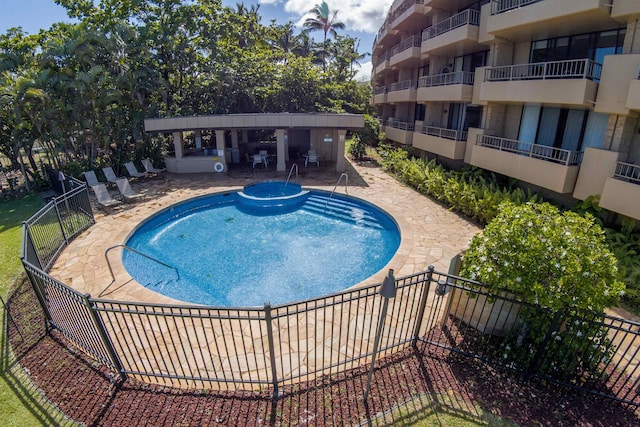 view of swimming pool with a patio