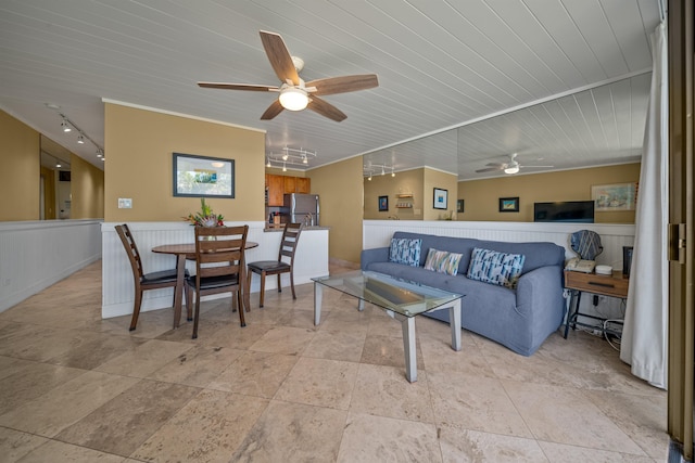 tiled living room with ceiling fan, track lighting, and wood ceiling