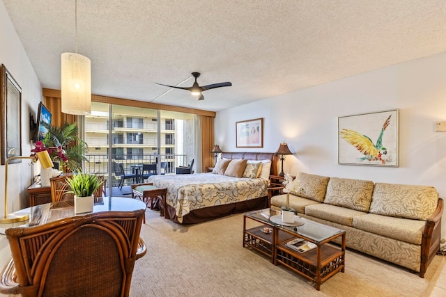 4365 Lower Honoapiilani Rd Unit 603, Lahaina, HI 96761 - bedroom featuring carpet floors, a textured ceiling, and a ceiling fan