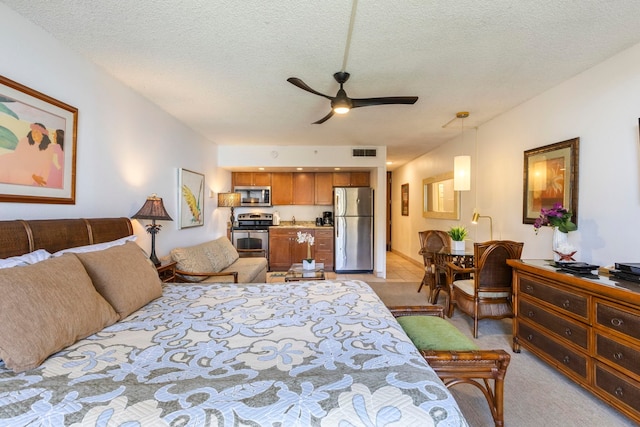 4365 Lower Honoapiilani Rd Unit 603, Lahaina, HI 96761 - bedroom with freestanding refrigerator, a textured ceiling, and light carpet