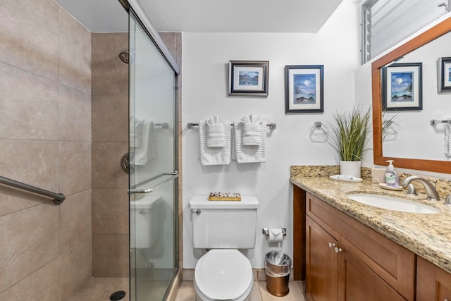 4365 Lower Honoapiilani Rd Unit 603, Lahaina, HI 96761 - bathroom featuring vanity, a shower stall, and toilet