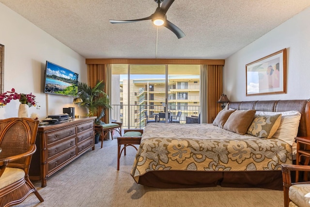 4365 Lower Honoapiilani Rd Unit 603, Lahaina, HI 96761 - bedroom with carpet floors, a textured ceiling, ceiling fan, and an office area