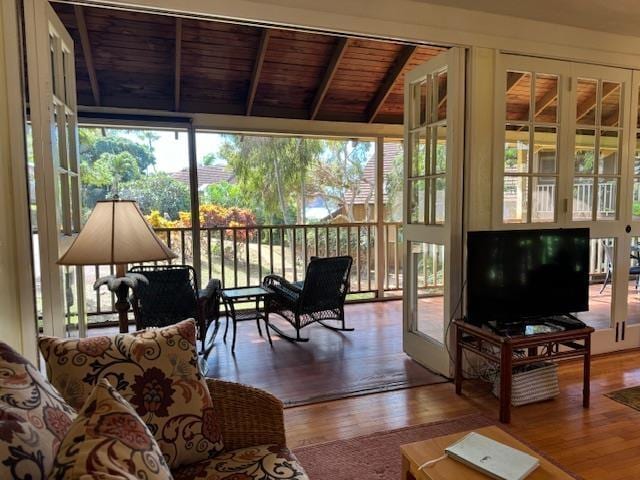 sunroom / solarium with vaulted ceiling with beams and wooden ceiling