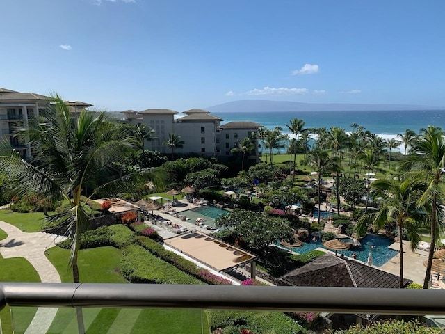 view of swimming pool with a water view