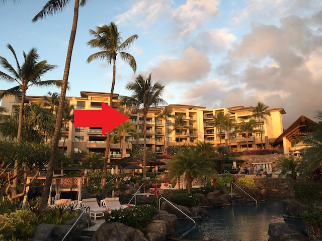 view of outdoor building at dusk