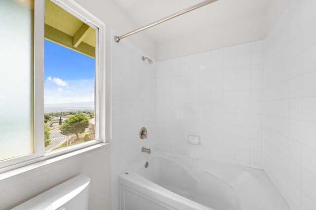 full bathroom featuring washtub / shower combination and toilet