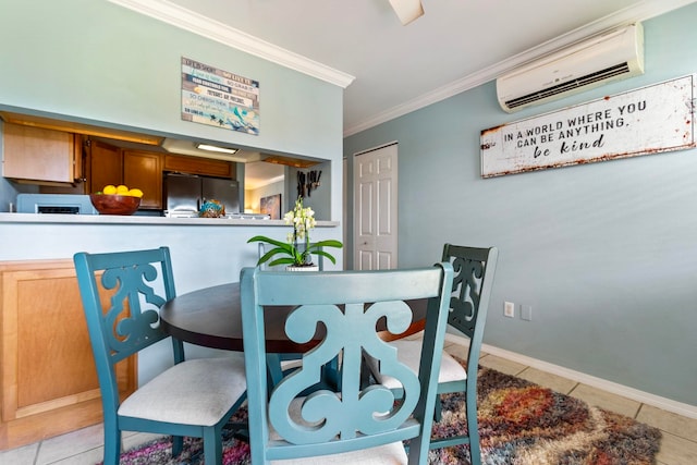 dining area with light tile patterned floors, baseboards, ornamental molding, and a wall mounted AC