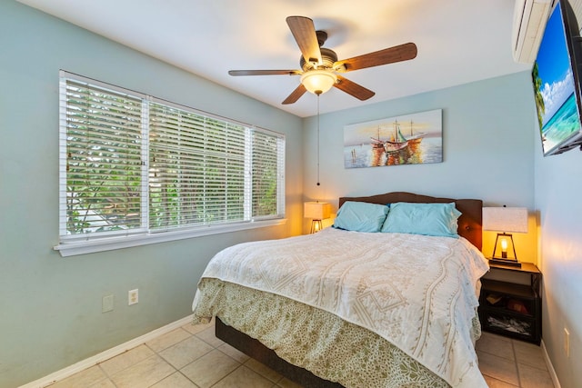 tiled bedroom featuring baseboards and a ceiling fan