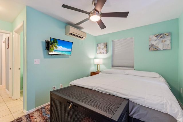 bedroom featuring light tile patterned floors, baseboards, ceiling fan, and a wall unit AC