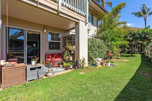 view of yard featuring a balcony