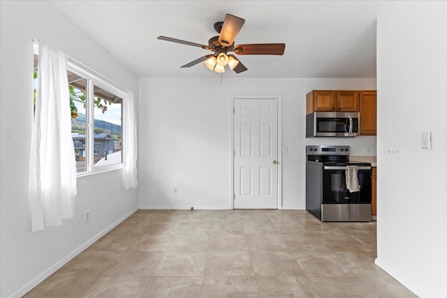 kitchen featuring appliances with stainless steel finishes and ceiling fan