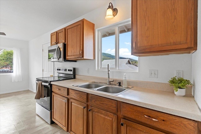 kitchen with appliances with stainless steel finishes and sink