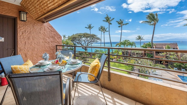 balcony featuring a water view