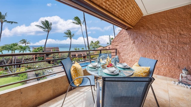 balcony featuring a water view